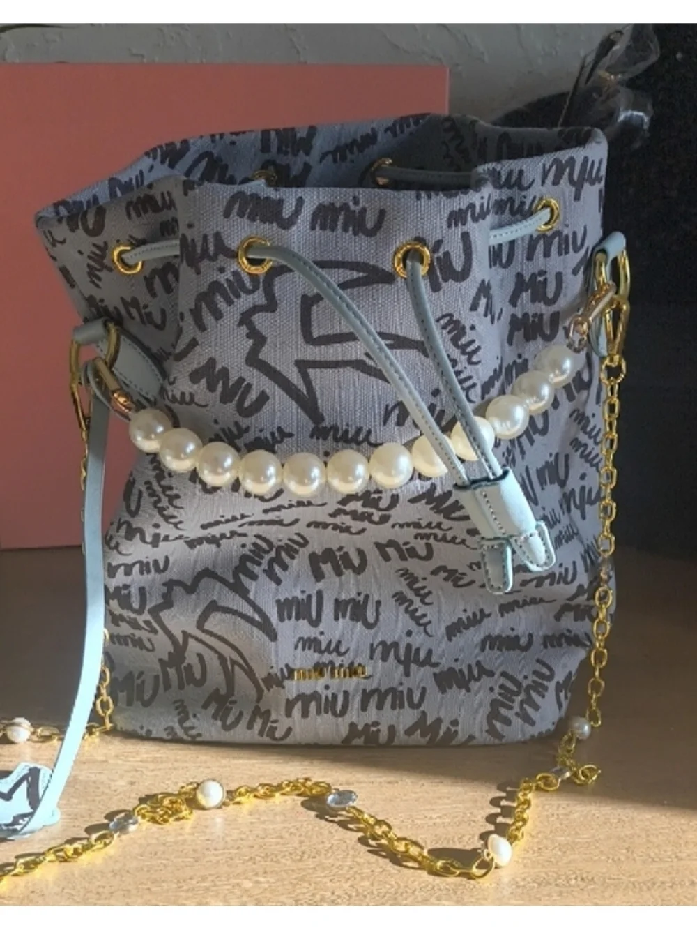 Miu Miu Gray Logo Drawstring Mini Bag with Light Blue Accents and Pearl Handle - Picture 4 of 4